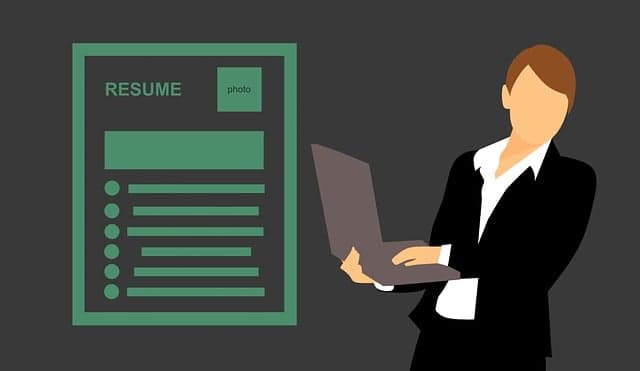Student preparing resume on laptop with digital tools open